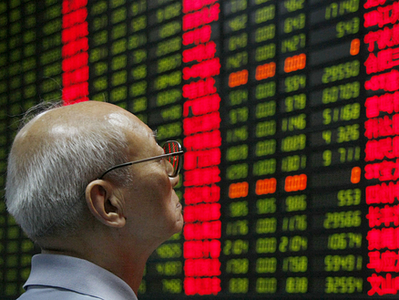 [An investor looks at the stock-price monitor at a private-security company in Shanghai Tuesday, as  Chinese stocks plunged.]