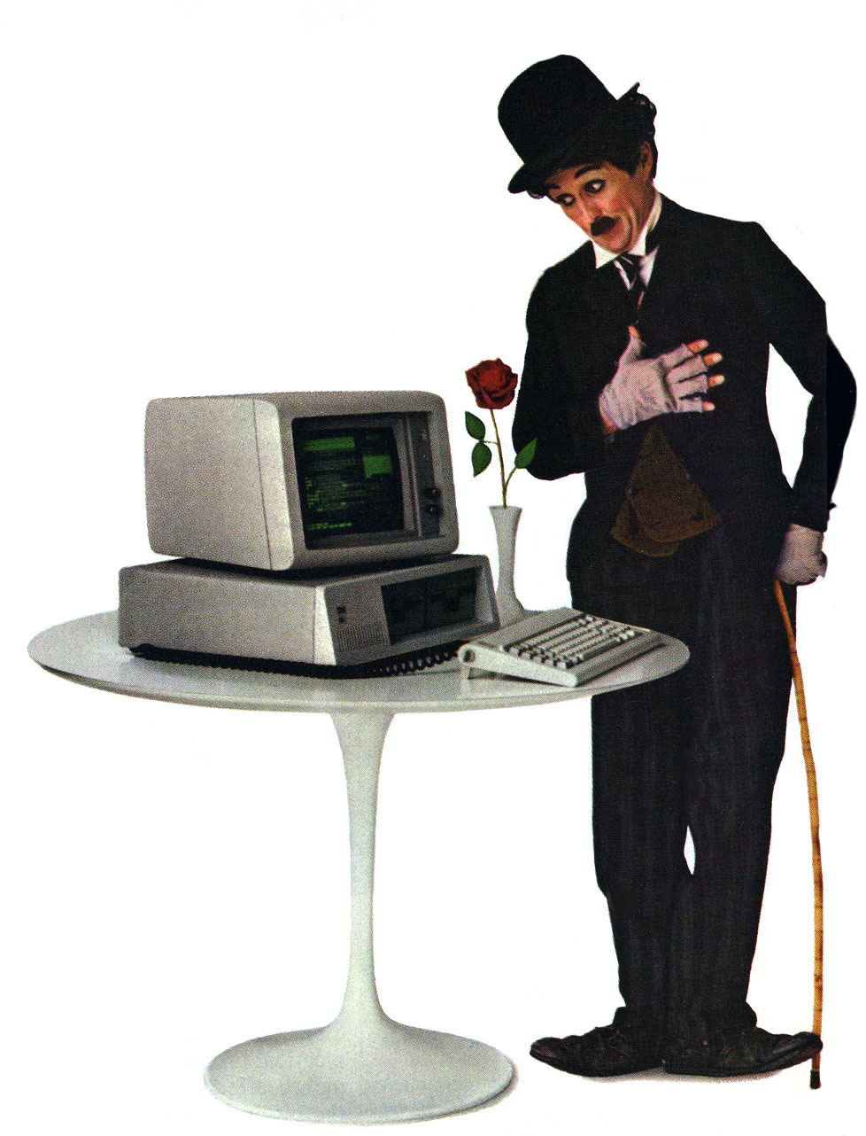 Photo of IBM PC advertisement with a Charlie Chaplin like person, rose and PC