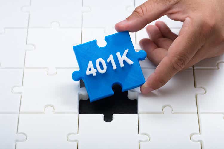 Man placing final 401k piece into jigsaw puzzle