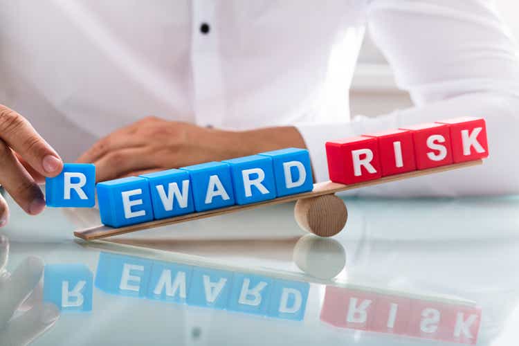 Businessman showing unbalance between reward and risk