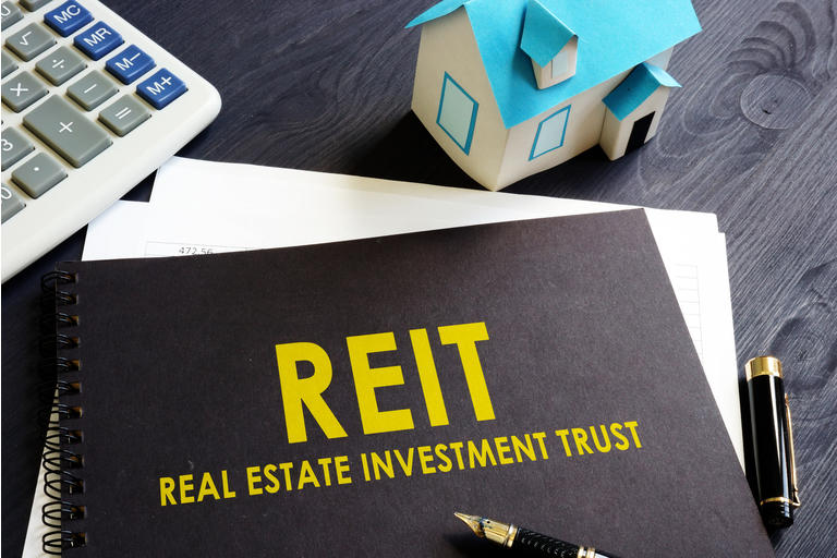 Real estate investment trust REIT on an office desk.