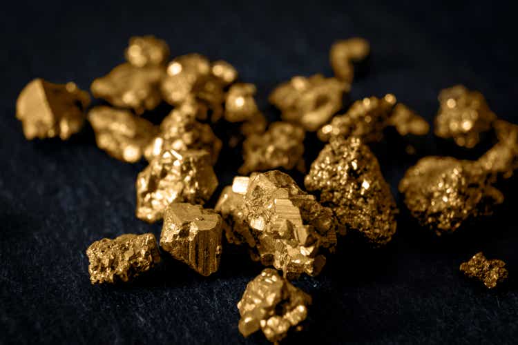 Gold nuggets on black background