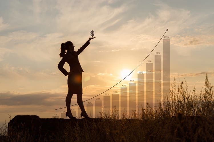 Businesswoman with dollar sign in hand .