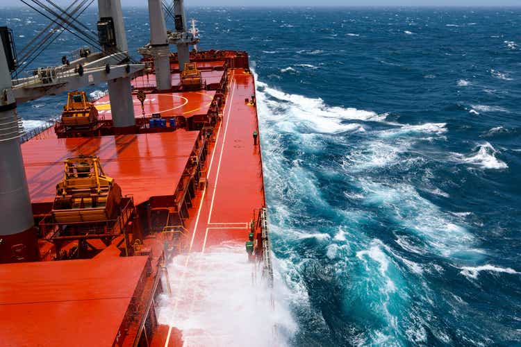 Cargo ship rolling in stormy Indian Ocean