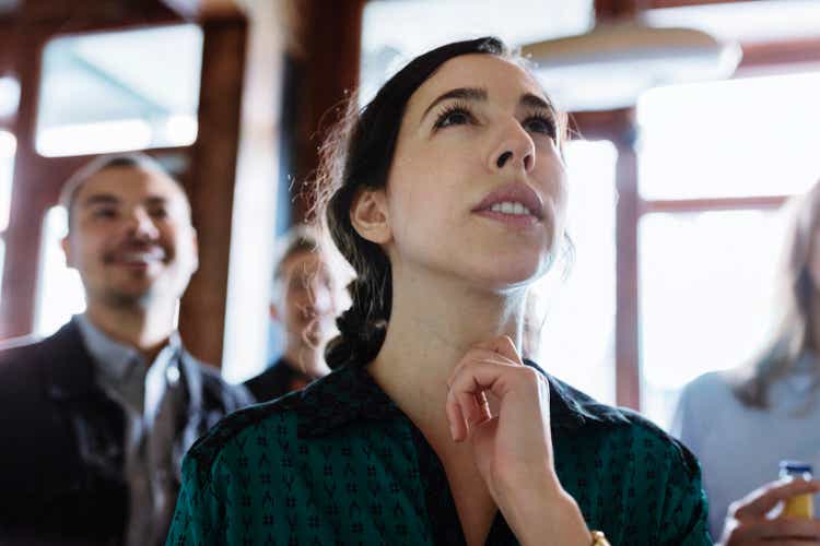 Customers Looking At Specials On Menu