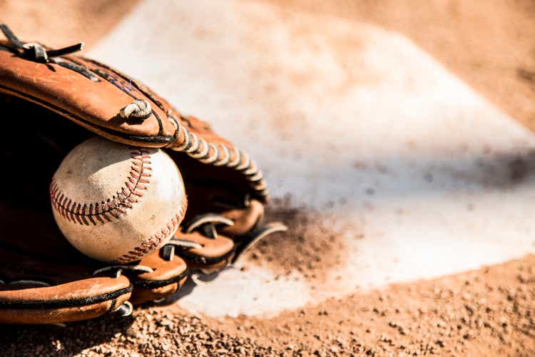 Baseball season is here.  Glove and ball on homeplate.