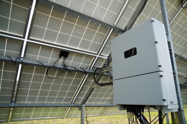 Inverter behind the solar panels. Renewable energy.