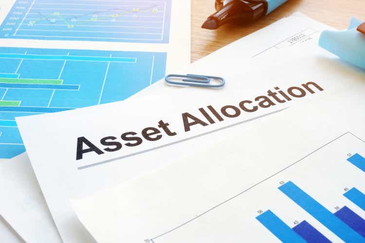 Asset allocation. Financial documents and pen on an office desk.