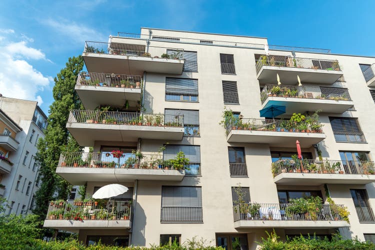 Gray modern multi-family house with balconies