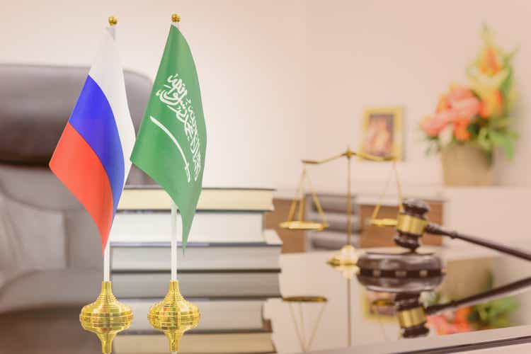 Business dialogue, military and oil agreement concept : National flags of Russia and Saudi Arabia on a table. A symbol of cooperation between two nations, Moscow / Kremlin and Riyadh, an Islamic state