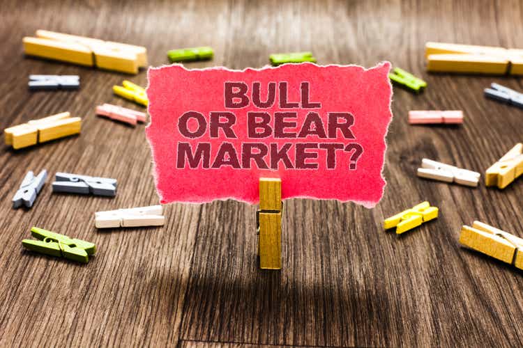 Conceptual hand writing showing Bull Or Bear Market question. Business photo text asking someone about his marketing method Clips spread woody table learn study things class schooling.