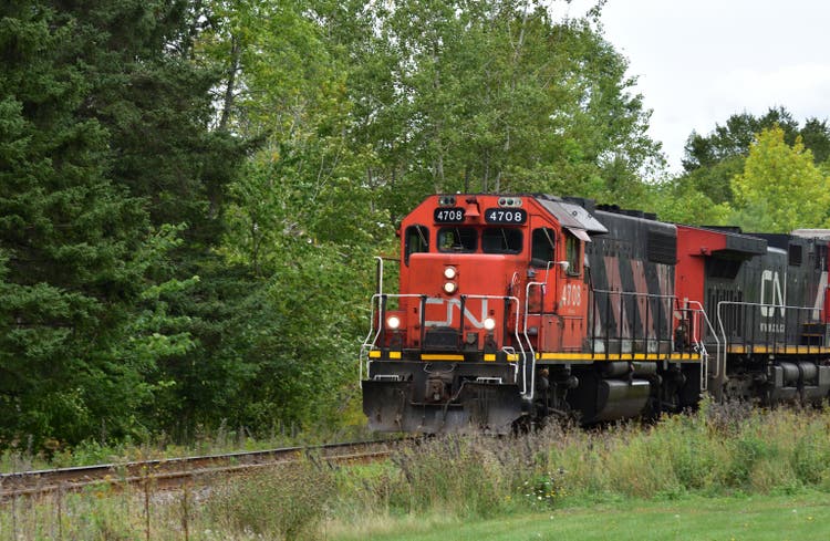 Man in CN Train Moving Through Hampton