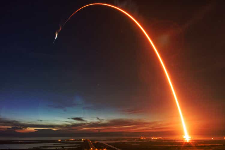 Missile launch at night. Elements of this image provided by NASA.