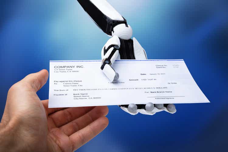 Robotic Hand Giving Cheque To Person