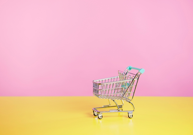 toy shopping trolley with pink and yellow background