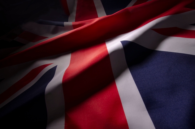 The Union Jack flag of Great Britain in shadow