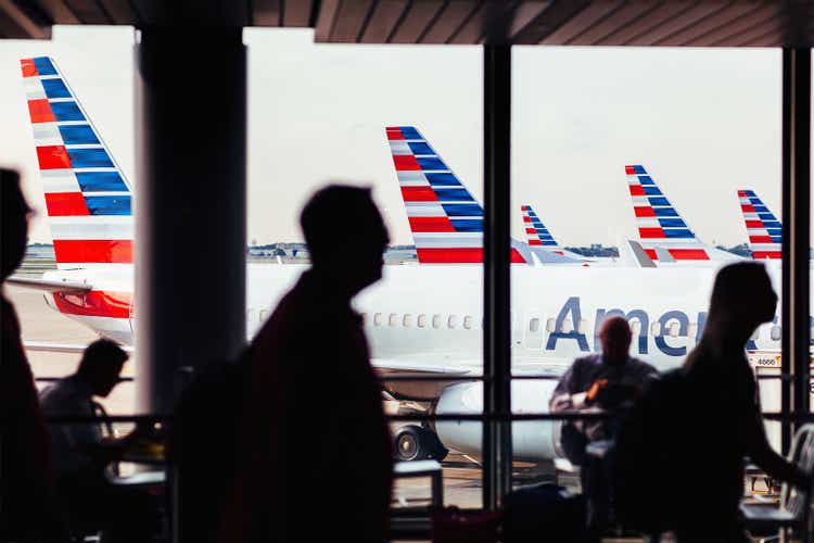American Airlines fleet of airplanes with passengers at O"Hare Airport