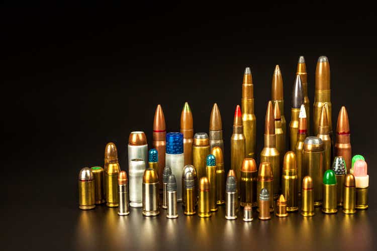 Different types of ammunition on a black background. Sale of weapons and ammunition. The right to hold a gun.