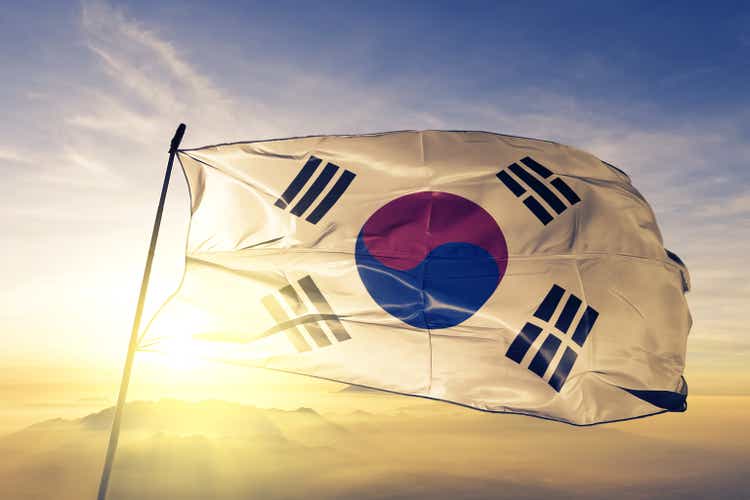 South Korea Korean flag textile cloth fabric waving on the top sunrise mist fog