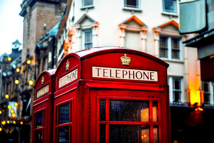 Classic British red colored pay telephone booths in London, England, UK