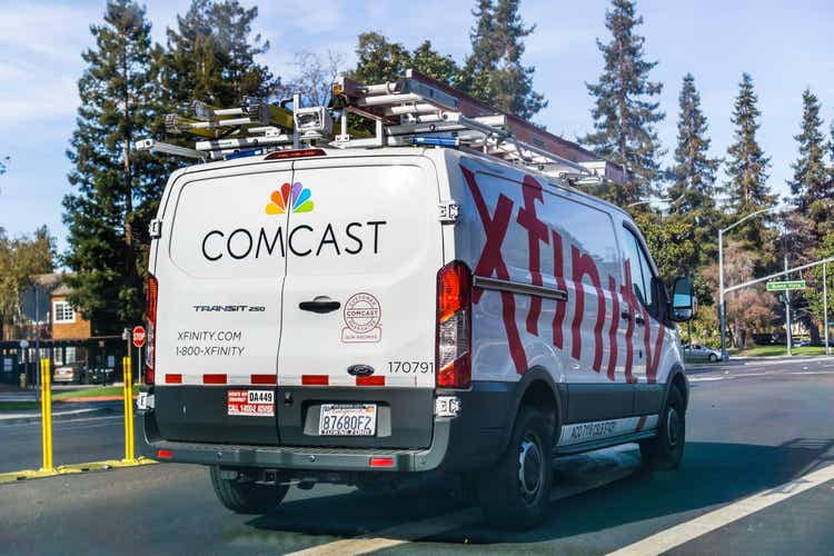 Comcast Cable / Xfinity service van driving on the street
