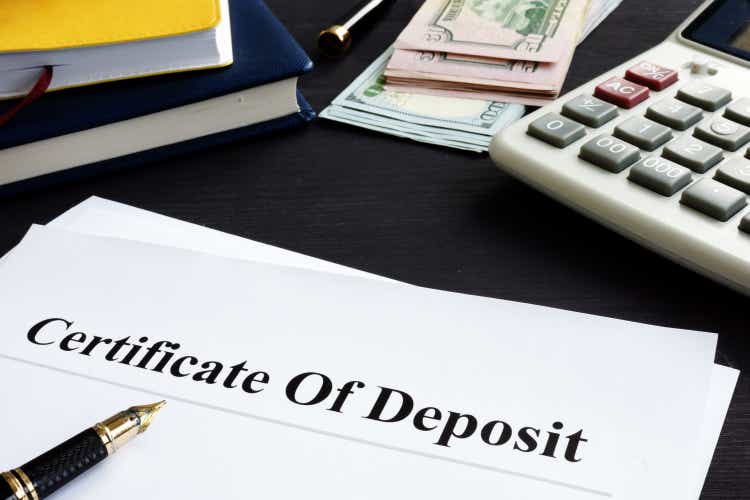 Certificate of deposit and pen in the office.
