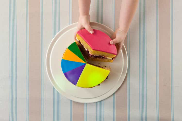 A child takes slice of a "pie chart" cake.