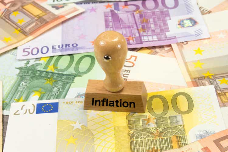 Euro banknotes and a stamp with the imprint inflation
