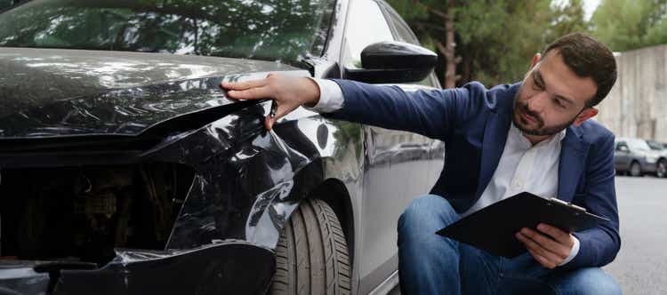 Inspection of car damage after an accident