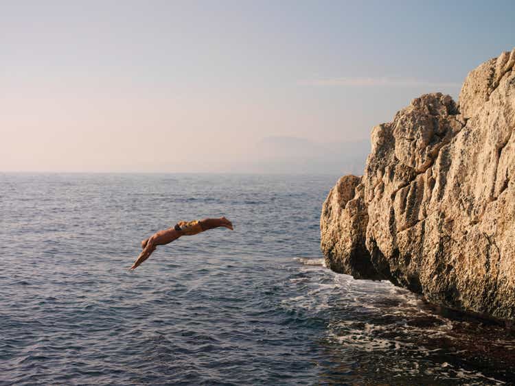 Man dives off cliff into sea