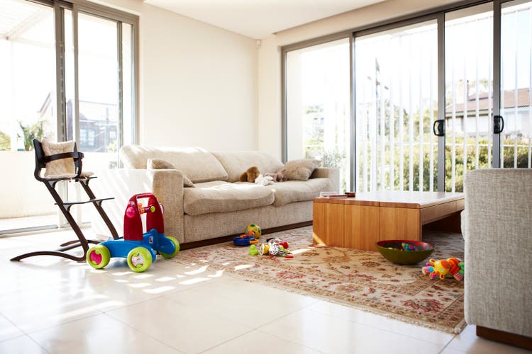 Empty lounge room with scattered toys