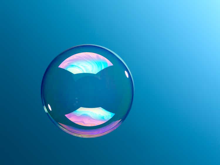Bubble floating against blue background