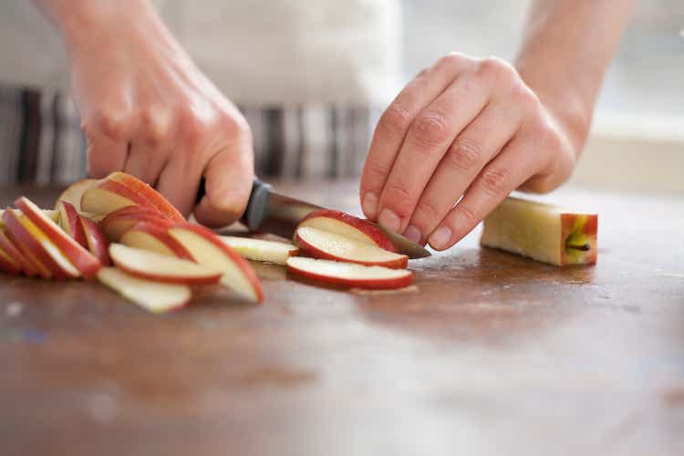 Girl chopping apple