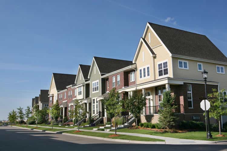 Row of Suburban Townhouses on Summer Day