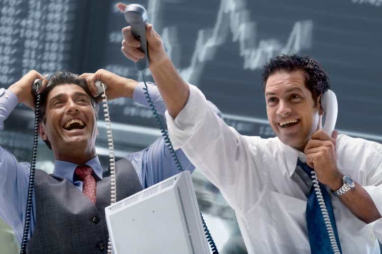 Two Happy Brokers at Stock Exchange