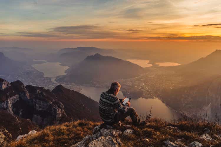 Man hiker solo on the mountain during golden hour