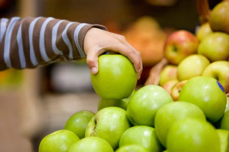 Child holding an apple