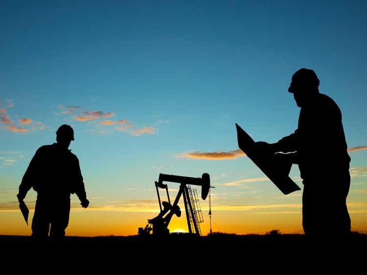 Oil Well Pump Pumpjack & Worker Silhouettes