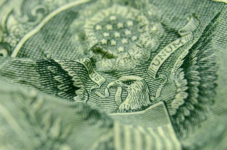 Selective focus on the eagle"s face from the reverse of the US 1 dollar bill.