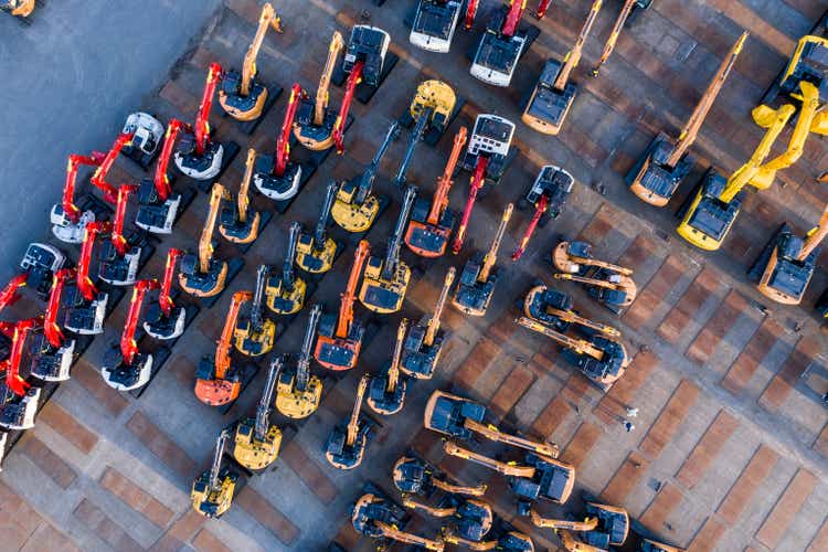 Aerial photograph of outdoor warehouse of construction machine.