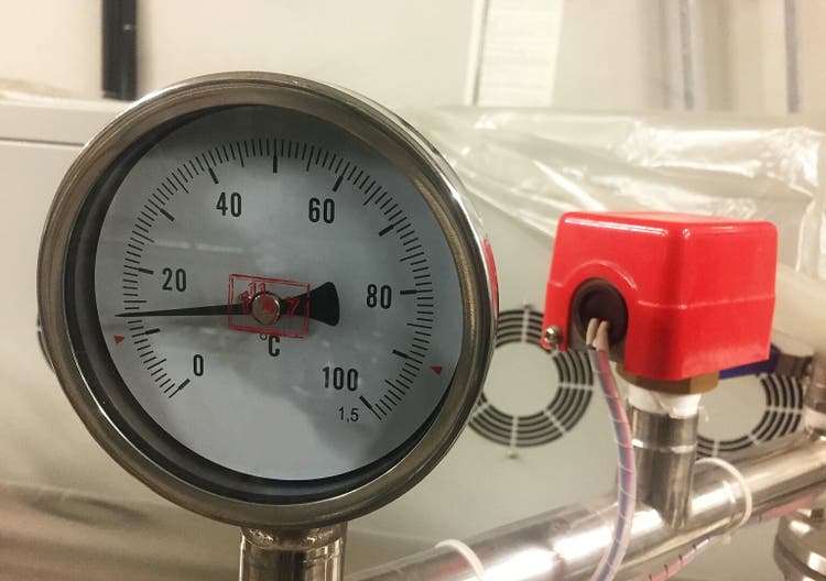 Analog temperature meter at an industrial facility