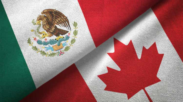 Canada and Mexico two flags together textile cloth fabric texture