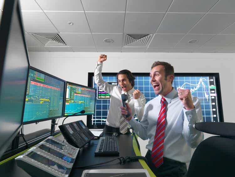 Successful financial trader and screens