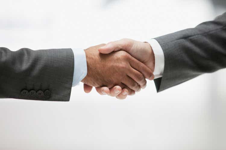 Businessmen shaking hands, close up