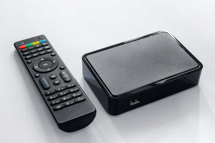 Iptv box and remote controller. Modern multimedia device for viewing television via the Internet, multimedia player and control panel.