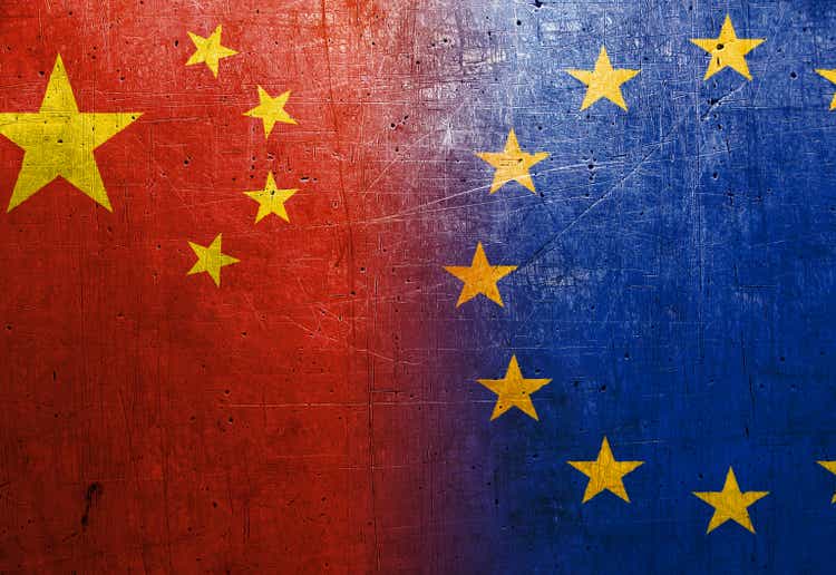 China and EU flags on the grunge metal background