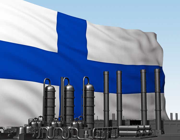 black factory in front of flag Finland