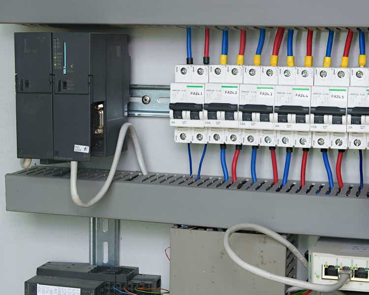 Image shows control cubicle. Schneider electric device and Schneider circuit breakers inside power case.
