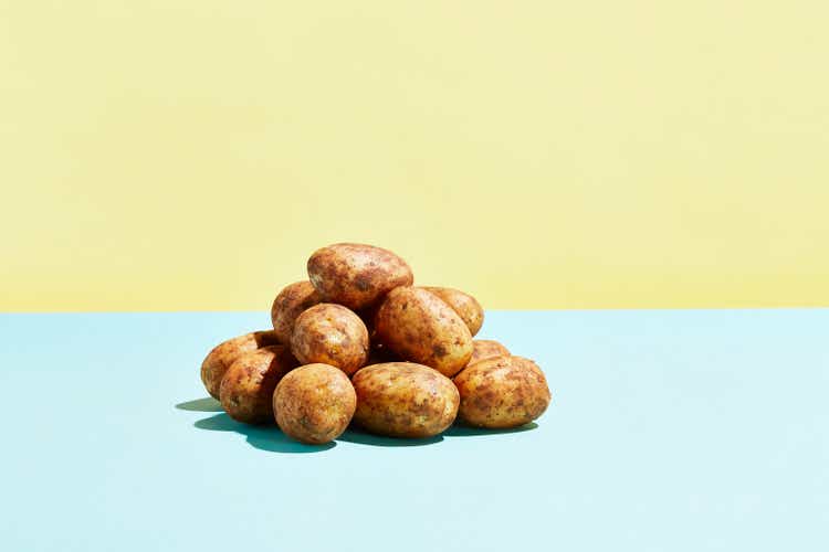 A pile of potatoes on a table top