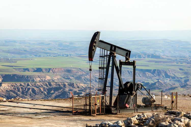 View of pumpjack in oil well of oil field.  The arrangement is typically used for onshore wells that produce little oil.  Pumpjacks are common in oil-rich areas.